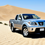 니산 프론티어와 GMC 캐니언 비교 - **Prompt:** "A Nissan Frontier pickup truck, fully clothed, parked in a desert landscape with sand d...
